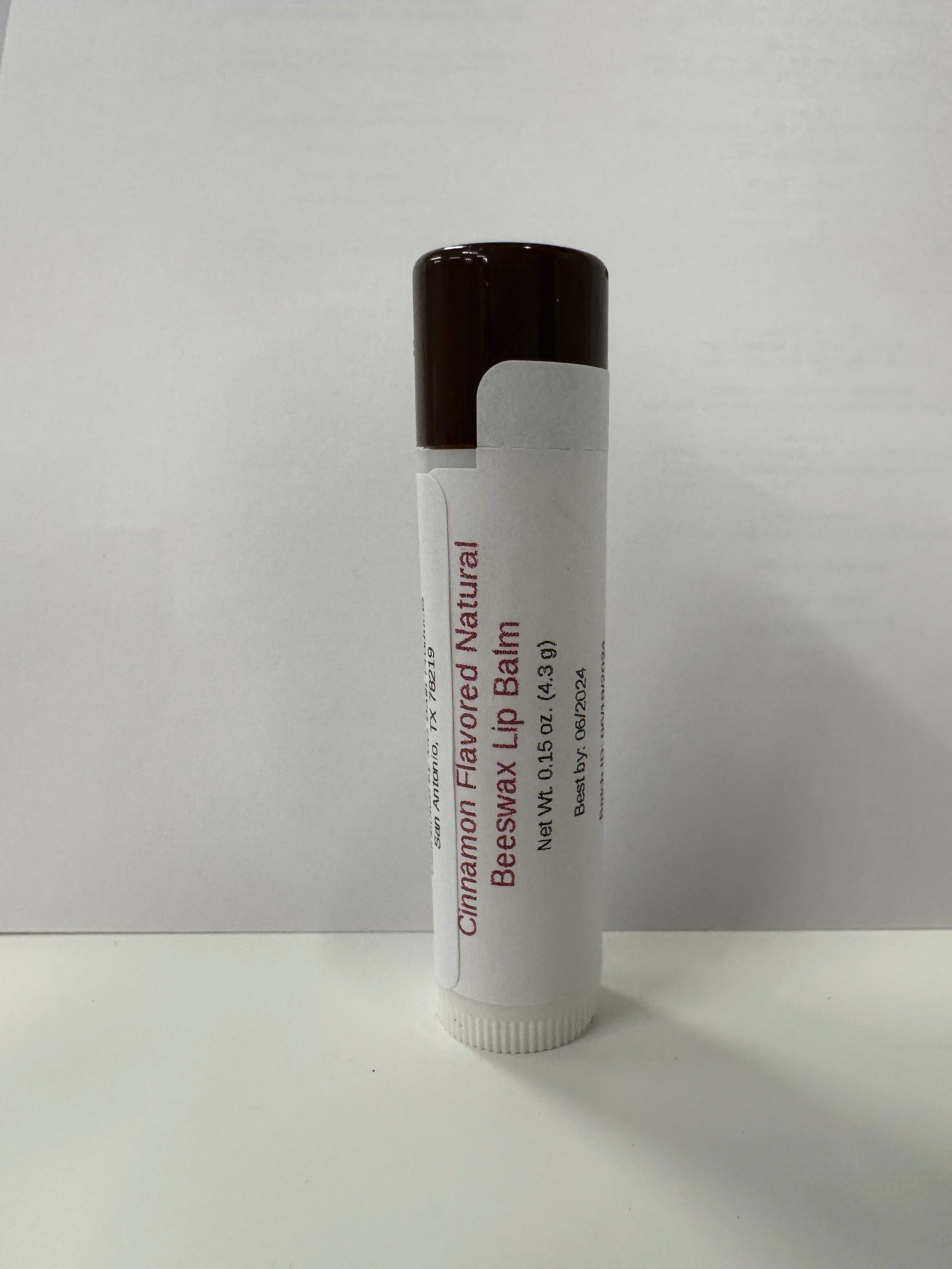 Lip balm in tube that has a brown colored cap on it.