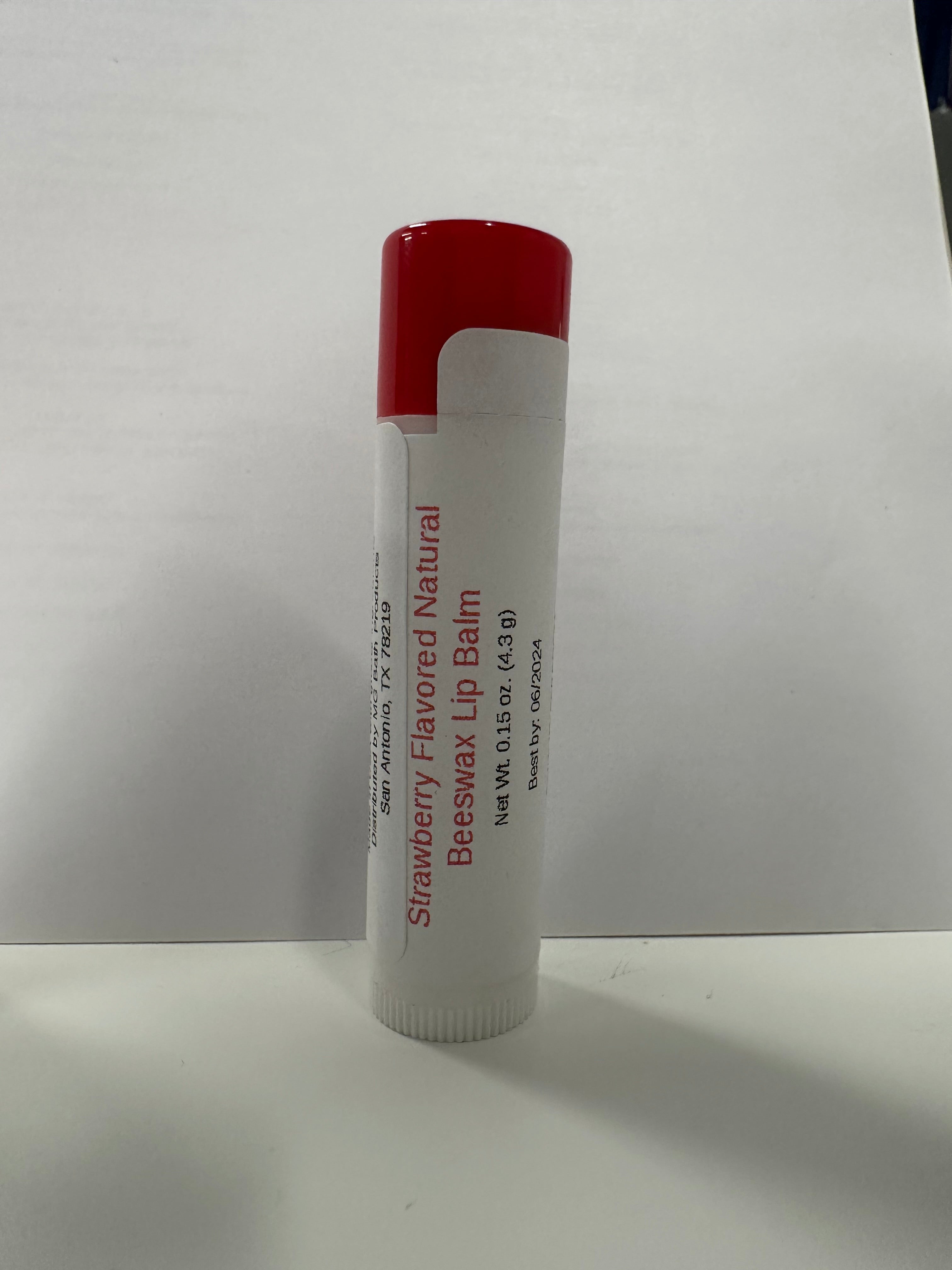 Lip balm in tube that has a red colored cap on it.