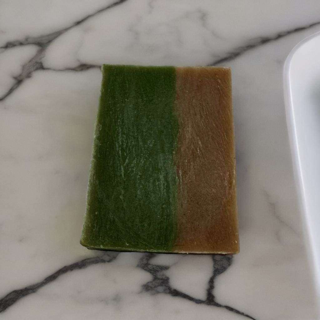 Almond Dreams Goat Milk Soap Bar - MG Bath Products Soap bar that is colored dark green on the left side and dark brown on the right side.soap bar