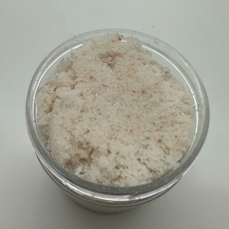 White colored bath salts in a opened jar. 